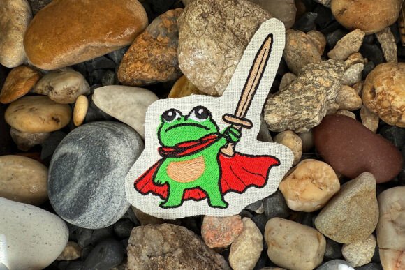 Cute Brave Frog Machine Embroidery Design: A Heroic Holiday Hit?